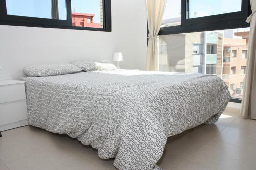Postel nebo postele na pokoji v ubytování Apartamento Plaza Felipe V Inmomart