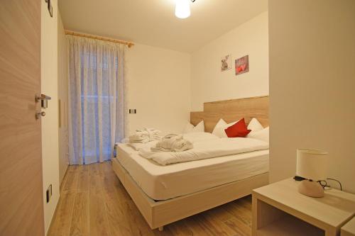 Postel nebo postele na pokoji v ubytování casa vacanze arcobaleno