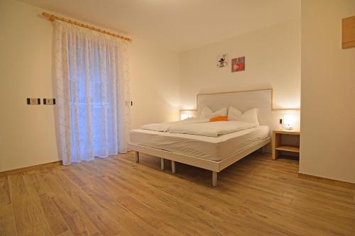 Postel nebo postele na pokoji v ubytování casa vacanze arcobaleno