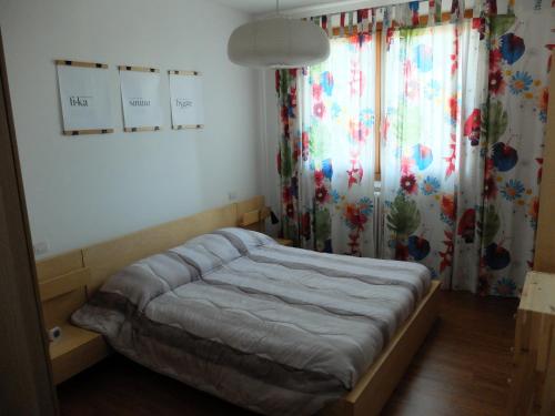 Ένα ή περισσότερα κρεβάτια σε δωμάτιο στο Moderno Trilocale Laura