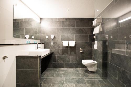 Ένα μπάνιο στο Bastion Hotel Apeldoorn Het Loo