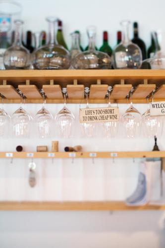 a bunch of wine glasses on a shelf at Schlegelhof in Kirchzarten