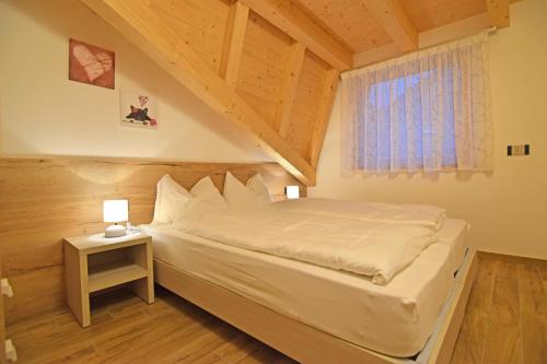 Postel nebo postele na pokoji v ubytování casa vacanze arcobaleno