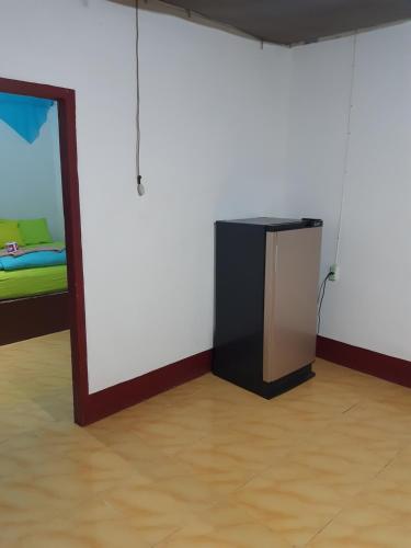 a room with a mirror and a small television at Som PalmGarden in Ko Lanta