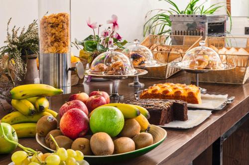 a table topped with lots of different types of food at One Shot Tabakalera House in Donostia-San Sebastián