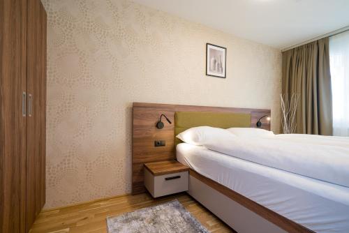 Ένα ή περισσότερα κρεβάτια σε δωμάτιο στο MyApartments Vienna