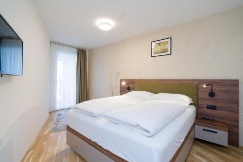 Ένα ή περισσότερα κρεβάτια σε δωμάτιο στο MyApartments Vienna