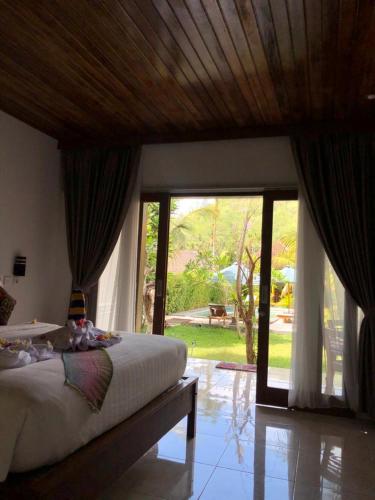 Una cama o camas en una habitación de Crystal Bay Bungalows