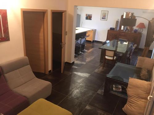 a living room with a couch and a table at Villa Olivea in Rayol-Canadel-sur-Mer