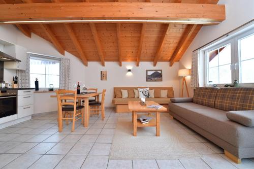 a living room with a couch and a table at Haus im Wäldle in Balderschwang