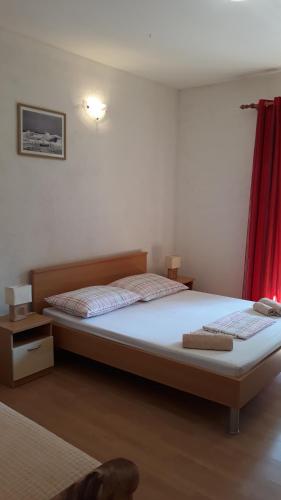 Ένα ή περισσότερα κρεβάτια σε δωμάτιο στο Apartments Limuni