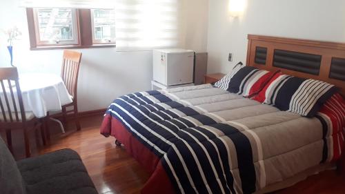 Postel nebo postele na pokoji v ubytování Nubes Hotel