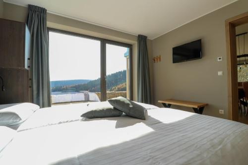 Postel nebo postele na pokoji v ubytování UplandParcs Bergblick