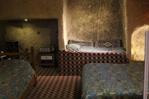En eller flere senger på et rom på Coco Cave