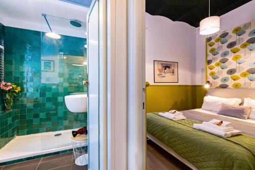 a bedroom with a bed and a bathroom with a shower at Rome As You Feel - Orti Trastevere Apartment in Rome