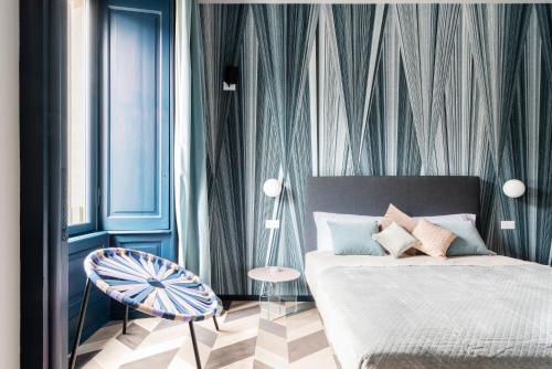 Кровать или кровати в номере Palazzo Visconti - by MyHomeInComo