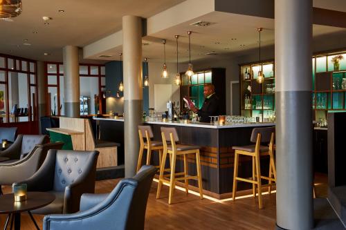 A restaurant or other place to eat at H+ Hotel Stuttgart Herrenberg