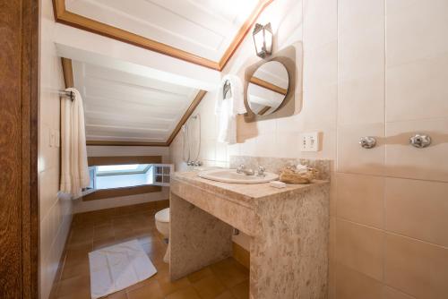 a bathroom with a sink and a toilet at Pousada do Mondego in Ouro Preto