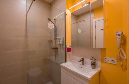 a bathroom with a sink and a shower at New Gudauri, Loft 1, #114, Cosy Apartment -Gondola lift in Gudauri