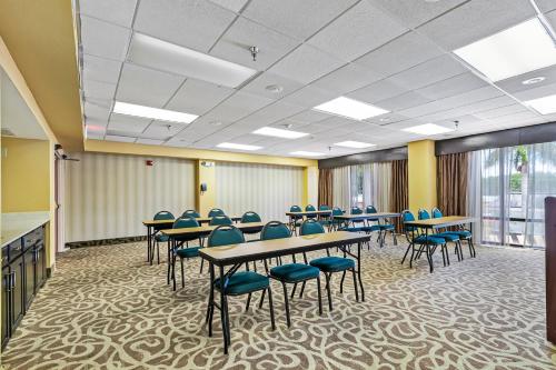 a classroom with tables and chairs in a room at Holiday Inn - St. Petersburg West by IHG in St Petersburg