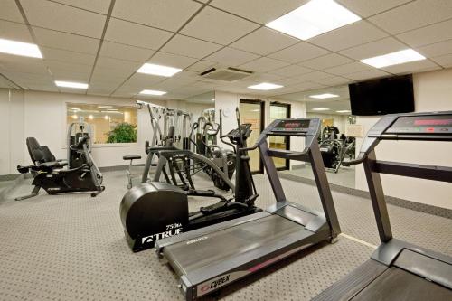 a gym with treadmills and ellipticals in a room at Holiday Inn Portland-By the Bay by IHG in Portland