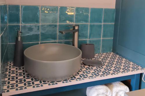 a bathroom with a bath tub on a tiled floor at Furzeleigh Mill Inn in Buckfastleigh