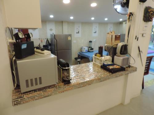 a kitchen with a counter with a appliance on it at Blue Paradise Residence in Rawai Beach