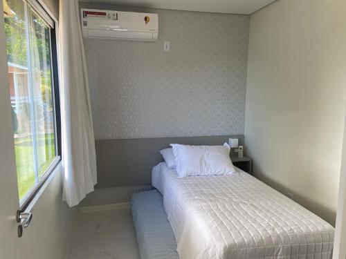Tempat tidur dalam kamar di Container no Vale dos Vinhedos em Bento Gonçalves