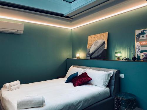 Letto o letti in una camera di Dimora del Teatro
