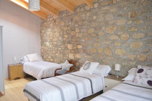 A bed or beds in a room at Lo Cel De Tolo