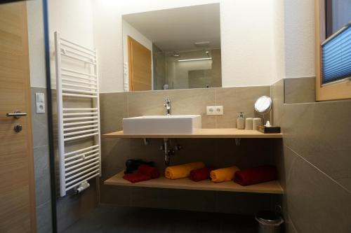 a bathroom with a sink and a mirror at Schlossbichl in Nauders