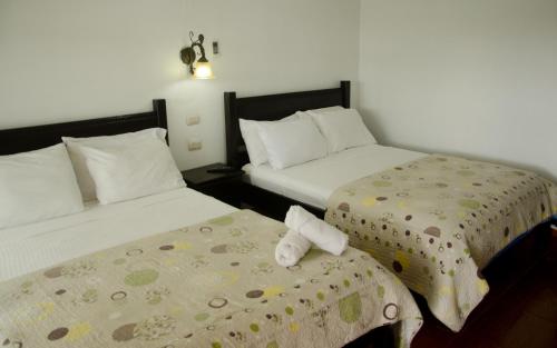 Postel nebo postele na pokoji v ubytování Hotel Cielo Azul Resort