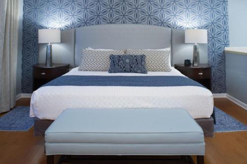 a bedroom with a large bed and two night stands at Best Western PLUS Franklin Square Inn in Troy