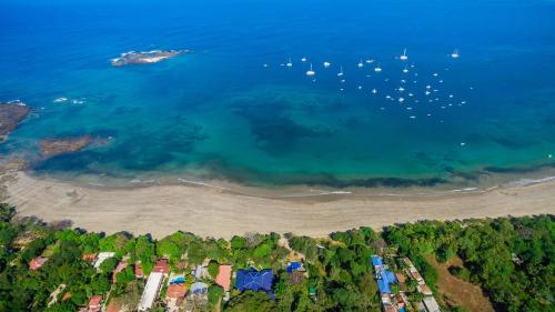 an aerial view of a beach with boats in the water at Jet Luxury at Langosta Beach Resort & Villas in Tamarindo
