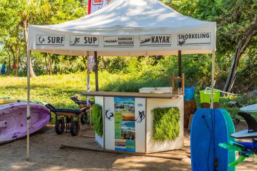a food stand under a tent in a park at Jet Luxury at Langosta Beach Resort & Villas in Tamarindo