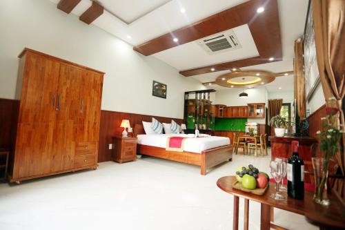Giường trong phòng chung tại Tan Doan An Bang center beach villas