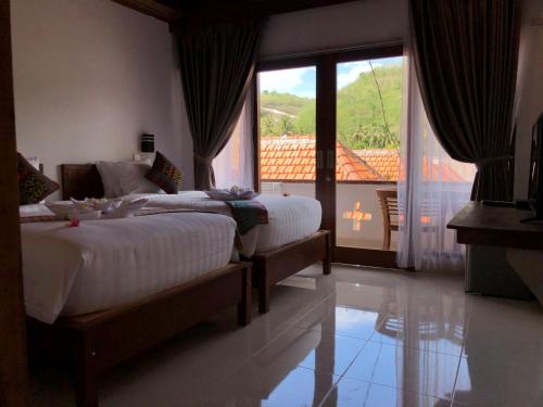 Una cama o camas en una habitación de Crystal Bay Bungalows