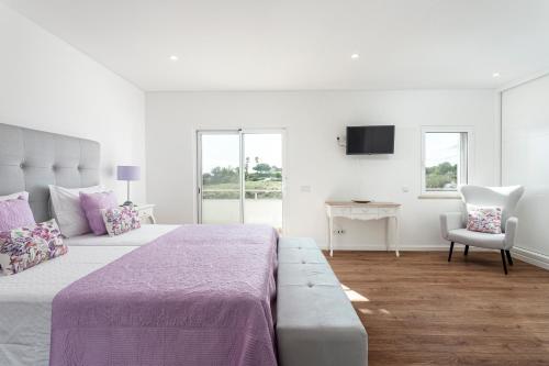 Ένα ή περισσότερα κρεβάτια σε δωμάτιο στο Luxury Vau Beach Villa with Private Heated Pool