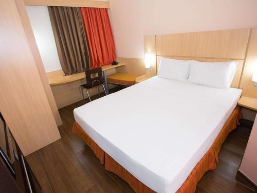 Postel nebo postele na pokoji v ubytování ibis Feira de Santana