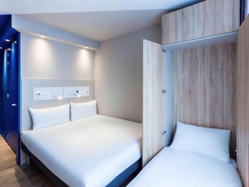 Кровать или кровати в номере ibis budget Amsterdam City South