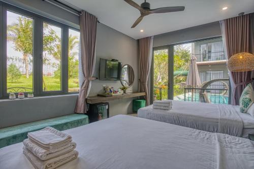 Säng eller sängar i ett rum på Sea’lavie Boutique Resort & Spa