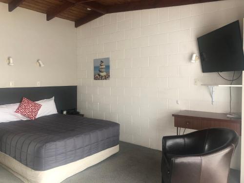 מיטה או מיטות בחדר ב-Thornton Lodge Motel
