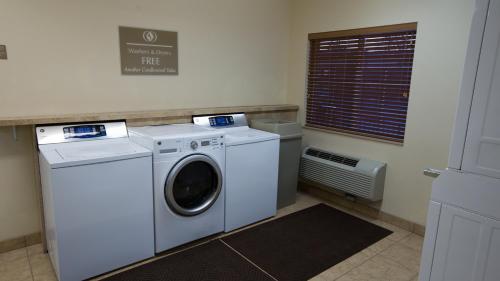 a laundry room with a washer and a dryer at Candlewood Suites Springfield-Medical District by IHG in Springfield