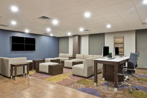an office with chairs and a desk with a computer at Holiday Inn Harrisburg East by IHG in Middletown