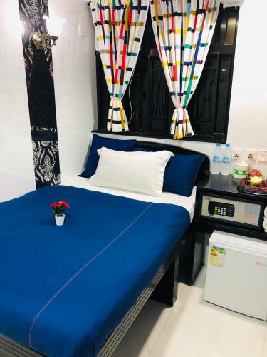 a bed in a room with blue and white at Australia Lounge in Hong Kong