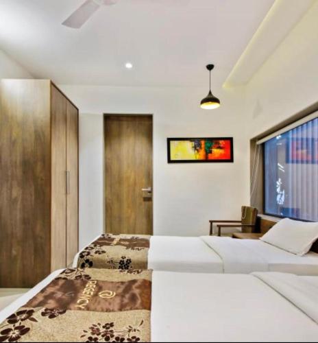 Posteľ alebo postele v izbe v ubytovaní Hotel Regency