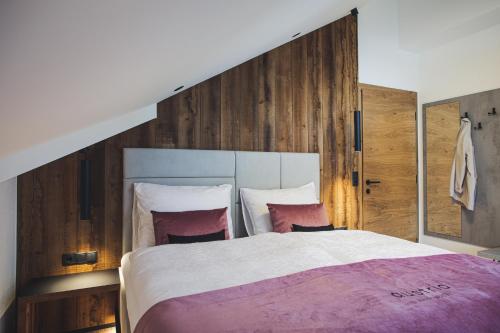 Een bed of bedden in een kamer bij Austria Aparthotel