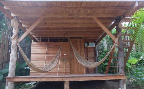 a hammock in a tree house at The Tropical Koh Mook in Koh Mook