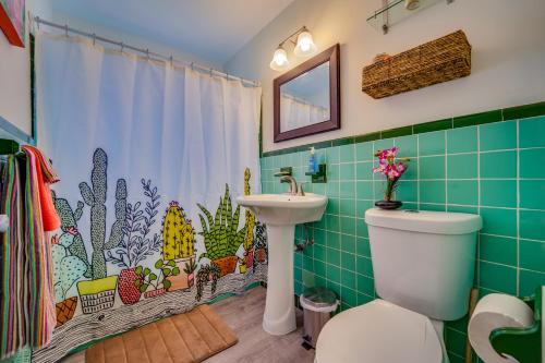 a bathroom with a toilet and a sink at Hainsley Apartments - Walk to Wilton Drive in Fort Lauderdale