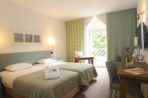 Ein Bett oder Betten in einem Zimmer der Unterkunft Holiday Inn Resort le Touquet by IHG